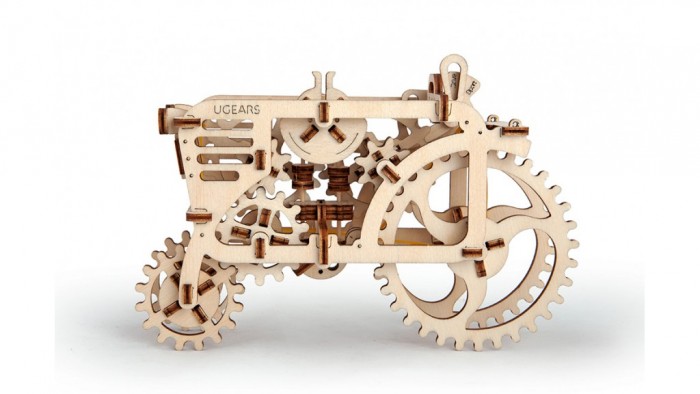 Конструктор Ugears 3D-Пазл Трактор 97 деталей3D-Пазл Трактор 97 деталей Конструктор Ugears 3D-Пазл Трактор 97 деталей3D-Пазл Трактор 97 деталейКонструктор 3D-Пазл Ugears Трактор – это деревянный механический конструктор, собрав который вы получите самостоятельно движущуюся модель. Трактор имеет полный привод, то есть крутящий момент подаётся и на переднюю, и на заднюю оси. Модель сможет преодолевать небольшие препятствия и двигаться по пересечённой местности. Под капотом – полноценный резиномотор с трёхступенчатой коробкой передач. Дизайнеры автогиганта Ugears создали абсолютно прозрачное покрытие, которое позволит непосредственно наблюдать за работой двигателя и каждого поршня. Передача «Park» служит для «заправки» резиномотора: чтобы завести его, покрутите заднее колесо. На передаче «Drive» модель поедет довольно неторопливо (около 5 см/с), а для любителей скорости есть передача «Sport». Дизайн Игрушка имеет классический абрис трактора с открытой кабиной. Боковые стенки тоже открыты – чтобы можно было видеть, чем живёт внутренняя машинерия. В виде шестерёнок, основного мотива серии, выполнены даже колеса. Вы не найдёте в этой модели острых углов: он будто собран из дуг и окружностей, и его прямые плавно переходят друг в друга даже во внутренних вырезах. Набор изготовлен из фанеры при помощи программируемого лазерного станка: детали легко выдавливаются из планшетов, заусенцев практически не образуется, все надписи (режимы движения, условные обозначения, логотип производителя) нанесены тоже при помощи лазера. По качеству эти модели намного превосходят изготовленные штампованием. Как это работает? Для сборки этой модели достаточно выдавить готовые детали и собрать их, следуя инструкции. Крепление производится посредством специальных гнёзд и пазов. Также понадобится несколько обыкновенных зубочисток и канцелярская резинка для мотора. В Тракторе много подвижных сочленений, и важно, чтобы каждое работало как часы. Оси скрипящих шестерёнок и заедающие зубчики можно смазать парафиновой или восковой свечкой. Заводить мотор нужно, поворачивая задние колёса. Скорости переключаются небольшим рычажком на верху модели, а поясняющие подписи не дадут вам стартовать с ручника. Характеристики Материал фанера (ФК) Размеры упаковки 370 × 170 × 30 мм Размеры модели 201 × 137 × 87 мм Количество частей 97 Что в коробке Набор планшетов с деталями для сборки 3D-пазла Трактор Документация (RU, UA, EN)<br>
