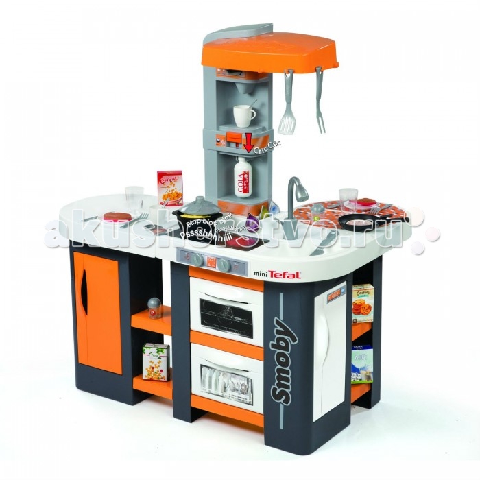 Smoby Кухня Tefal Cuisine Studio XL звукКухня Tefal Cuisine Studio XL звук Smoby Кухня Tefal Cuisine Studio XL звукКухня Tefal Cuisine Studio XL звукSmoby Кухня Tefal Cuisine Studio XL звук 311002 Детская кухня Studio XL из серии Tefal от производителя Smoby наверняка понравится девочкам, любящим проводить время на кухне и помогать родителям по хозяйству. Все комплектующие набора полностью безопасны, потому, можно не бояться, что маленькая хозяйка случайно поранится в процессе игры. В данный набор входит не только основа, состоящая из мойки для посуды, плитки для приготовления пищи и кофемашины, но и множество аксессуаров. Среди них можно выделить традиционный набор посуды и игрушечные продукты, из которых ребенок сможет приготовить вкусный обед для своих кукол и других игрушек. Данная игрушка может стать хорошим дополнением к различным сюжетно-ролевым играм, в которые так любят играть дети. Комплект: кухня, 36 аксессуаров. Размер кухни: 86 х 62 х 100 см.<br>