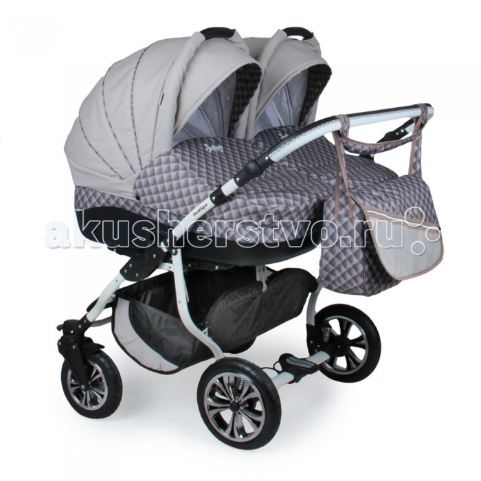 Indigo Коляска для двойни Duo Color 2 в 1Коляска для двойни Duo Color 2 в 1 Indigo Коляска для двойни Duo Color 2 в 1Коляска для двойни Duo Color 2 в 1Slaro Indigo Duo Color - практичная и красивая модель для двойни. Коляска оснащена поворачивающимися колесами и двумя независимыми люльками, для большего удобства. Продуманная функциональная конструкция делает ее комфортной и удобной для малышей и родителя. Рама: Широкая рама на поворотных колесах, с возможностью установки на нее двух люлек или двух прогулочных модулей Надувные колеса снижают уровень вибрации, что обеспечит малышу комфорт во время движения по неровной дороге Для повышения уровня комфорта коляска оборудована двухступенчатым регулируемым амортизатором, который поглощает колебания независимо от нагрузки и скорости движения Центральный тормоз при необходимости можно нажать одной ногой, а процесс торможения всегда будет быстрым и надежным Установка элементов коляски (люльки, прогулочного модуля) возможна в обе стороны движения. Люлька: люлька устанавливается как лицом к маме, так и наоборот люлька оснащена теплым матрасом, внутренняя обивка люльки состоит из 100% хлопка люлька с удобной ручкой для удобного съёма, установки и переноса люльки благодаря ручке на капюшоне, люльку возможно использовать как переносную колыбельку большой капюшон с козырьком и вентиляционным окошком утепленный чехол на люльку с высоким бортом, который защитит малыша в плохую погоду от ветра в комплекте вместительная сумка и пеленальный матрасик, который всегда пригодится маме Прогулочный блок: в комплекте теплый чехол на прогулочный блок, который полностью защитит вашего малыша от любой непогоды спинка прогулочного блока регулируется в 4-х положениях, включая горизонтальное надёжная подножка обшита эко кожей(легко содержать в чистоте), регулируется в 4-х положениях для удобства вашего малыша у коляски 5-ти точечные ремни безопасности с мягкими плечевыми накладками, с 5-ю позициями фиксирования ремней в прогулочном блоке и надёжный фиксатор ремней прогулочный блок можно устанавливать в обоих направлениях, как лицом к дороге так и лицом к маме, что-бы было удобно наблюдать за малышом большой капюшон с козырьком оснащен вентиляционным окошком, прикрытым антимоскитной сеткой капюшон съёмный, легко снимается и одевается на прогулочный блок В комплект входит: 2 люльки 2 прогулочных блока Большая сумка для мамы 2 чехла на ножки Корзина для покупок Москитная сетка Матрас<br>